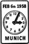 A white clock with black numbers

Description automatically generated