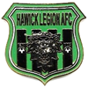 A green and black badge with a lion head

Description automatically generated