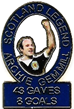 A blue and white badge with a person holding his fist up

Description automatically generated