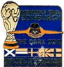 A blue and gold pin with a trophy and text

Description automatically generated